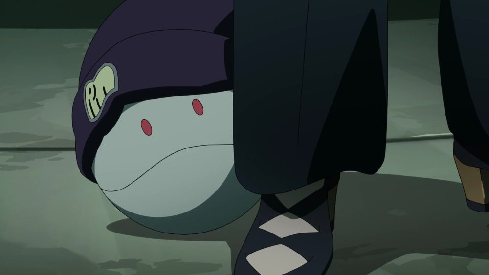 A light green Haro with red eyes sporting a black beanie as it hides behind someone's leg in Gundam GQuuuuuuX