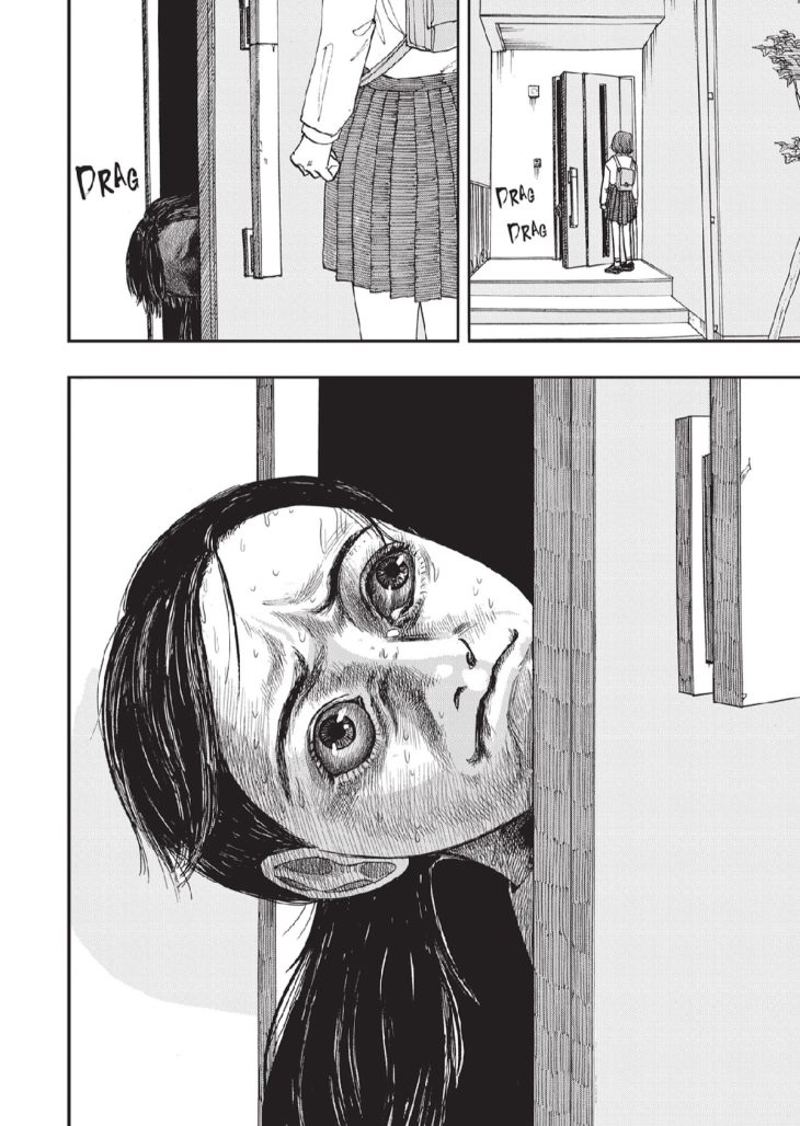 a girl sticks her head out of an open door and looks disturbed and tearful