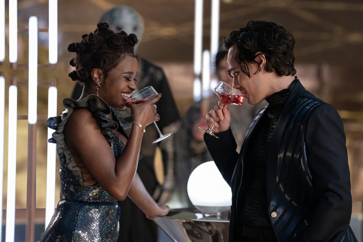 Uhura and Beto share drinks in Star Trek: Strange New Worlds Season 3.